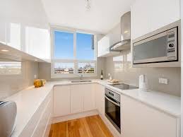 The sink doesn't necessarily need to be centrally located and may do more harm than good if it is. Modern Small U Shaped Kitchen Design Ecsac