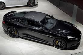 Aston Martin Looks To The Future At Paris Motor Show Auto World News Aston Martin Aston Martin Cars Aston Martin Vulcan