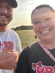 jr high cheerleaders give popsicles to football team