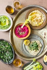 Sunset initiated the first day of the feast of unleavened bread. Various Types Of Hummus With Lettuce And Unleavened Bread Stock Photo Offset