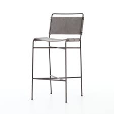 It features a comfy scoop seat and multiple stretchers for a comfortable seating experience. Jackson Bar Stool