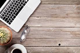 There's also open storage on the side, perfect for displaying your favorite coffee table books or other knickknacks. Desk Table With Laptop Coffee And Glasses On Wooden Table Workplace Top View With Copy Space Stock Photo Picture And Royalty Free Image Image 62201490