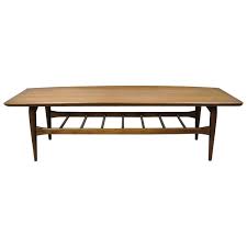The coffee table is an important piece of furniture in the living room. Vintage Mid Century Modern Bassett Walnut Sculpted Edge Surfboard Coffee Table At 1stdibs