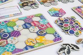 This is calico, a board game designed by kevin russ and published by aeg and flatout games. Calico Flatout Games