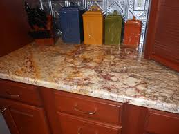 Since the material portrays earthy tones throughout the veins and swirls, pairing this material with other design features and palettes is simple. Typhoon Bordeaux Granite Countertop Copy Cabinets2countertops