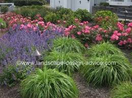 Stone slabs on raised beds are simply perfect in this small front yard landscaping idea. Creative Front Yard Landscaping Ideas
