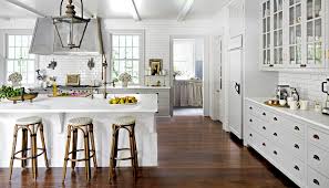 Grey kitchen walls with white cabinets and dark flooring options. 4 Kitchen Designs That Make Red Oak Flooring Shine