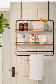 A row of wall hooks or a minimalist floating shelf near the door lets you keep your coat and bag within reach as you head out for work. Over The Door Tiered Storage Rack Urban Outfitters