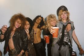 With guns n' roses, axl rose, tommy stinson. 35 Years Ago Guns N Roses Sign To Geffen Records