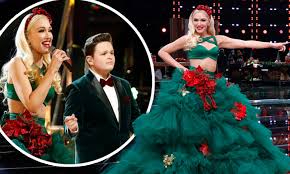 You can dress it up in string lights, garlands, tinsel, and a bit of fake snow, but perhaps the most important piece of decor is the ornaments. Gwen Stefani Rocks A Festive Christmas Tree Dress Singing You Make Me Feel Like Christmas Daily Mail Online