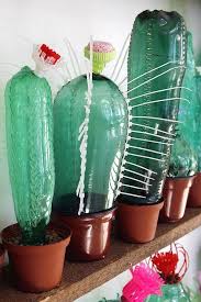 Go back to the front of your farm, and place your building material on top of the front cactus. Veronika Richterova Plastic Bottle Art Recycled Art Glass Bottle Diy Decoration