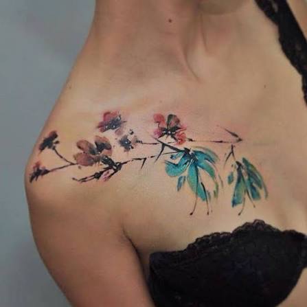 Watercolor style flower tattoos.