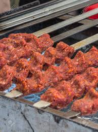 How to make middle eastern spiced lamb. Adana Kebab Ground Lamb Minced Meat On Skewer On Grill Over Charcoal Chef Preparing Traditional Authentic Turkish Shaworma Middle Eastern Cuisine Handmade Specialty Street Food Market With Spices Stock Photo Picture And Royalty