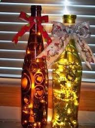 i love this idea etch wine bottles with glass etching solution and add lights and a bow voila festive wine bottle crafts glass crafts bottle crafts