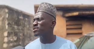 Momodou Sabally, Adviser to President Adama Barrow, speaks to a journalist  at Half Die Ward in Banjul