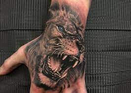 2021 Tattoo Prices How Much Do Tattoos Cost Lion Hand Tattoo Hand Tattoos For Guys Lion Hand Tattoo Men