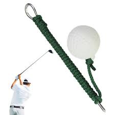 Golf training tool with a golf ball attached to a string and a stake