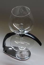 To brew coffee in a coffee pot. Vacuum Coffee Maker Wikipedia