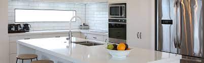 A new larger window floods the kitchen in natural light. Jag Kitchens Kitchen Design Build Auckland