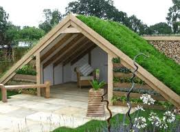 A green roof house is a house whose roof is partially or completely covered with a growing medium upon which different types of vegetation have been planted. Pros And Cons Of Green Roofs Roofgenius Com