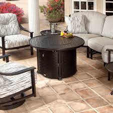 This elegant coffee table creates a refined lounge area in this gallery setting. Mallin Cambria 42 Round Chat Height Fire Table 9000 Cast Top Mf042s 9043f
