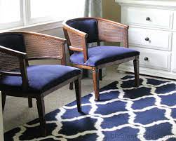 Once you reach a corner, fold the fabric inward, pull tightly and add a staple to hold the fold together. My Lazy Girl S Guide To Reupholstering Chairs A Tutorial Erin Spain