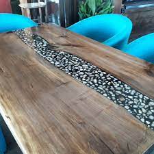 Finish the setup with stacking metal or resin dining chairs. Vidosav Milovanovic On Twitter Walnut Transparent Black Epoxy Resin With River Pebbles Natural Stone Hart And Led Light Dining Table Furniture Table Dining Epoxy Resin Handmade Unique Exclusive Https T Co R51hlmc2kj