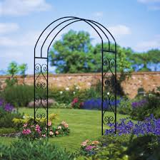 Train your plants to grow through the arbor by weaving them in and out of the structure as they grow. York Scroll Metal Rose Arch Arbour Burbage Iron Craft