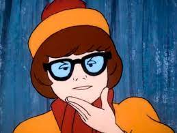 Velma with magnifying glass