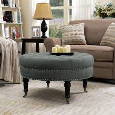This deep button tufted cushion top ottoman can add a touch of elegance to any room, adorned with elegant nail head trim using quality anti rust nails. Round Tufted Linen Ottoman With Caster 33 Traditional Footstools And Ottomans By Onebigoutlet Houzz