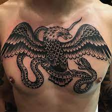 Tattoo Uploaded By Tattoodo The Iconic Eagle Vs Snake Tattoo By Paul Dobleman Pauldoblem Traditional Chest Tattoo Chest Tattoo Men Traditional Eagle Tattoo