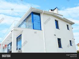 The use of clean lines inside and out, without any superfluous decoration, gives each of our modern homes an uncluttered frontage and utterly roomy, informal living spaces. Close On Modern House Image Photo Free Trial Bigstock
