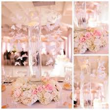 Butterfly quince decor for the venue that will brighten the atmosphere of the venue. New Beginnings Flowers And Playful Colors A Spring Themed Quinceanera Quinceanera Quinceanera Decorations Quince Decorations Quinceanera Centerpieces