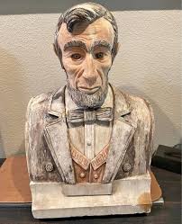 This lion done from dimes for the eyes and the rest are pennies it weighs  about 45 pounds and it still needs the main