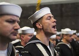 Master Chief Boatswain's Mate Kyle G. Sutton is committed to sea with a  ceremony