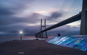 This striking bridge spans the tagus river at its widest section in the city of lisbon connection the northern suburb of sacavem to the historical the vasco da gama bridge is a vast stricture that is 17 km (11 miles) long.first opened in 1998 it is still the longest bridge in europe. Ponte Vasco Da Gama Portugal