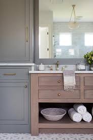 The most common brown grey bathroom material is soy. Gray Shaker Cabinets Surrounding Brown Oak Washstand Transitional Bathroom