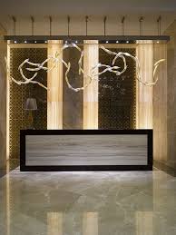 The Wyndham Hotel In Exciting Istanbul Features Luxuriously Appointed Individually Styled Roo Hotel Reception Desk Reception Desk Design Hotel Interior Design