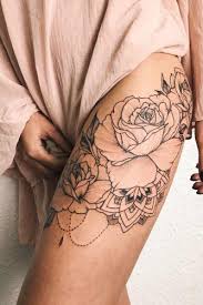This large tattoo is black and white with a lot of details. 33 Rose Tattoos And Their Origin Symbolism And Meanings