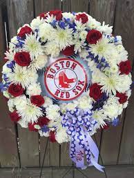 The bouquet has yellow and red flowers to impress love and sympathy for someone you will always remember. Sympathy Wreath For A Huge Red Sox Fan Sympathy Flowers Red Socks Fan 4th Of July Wreath