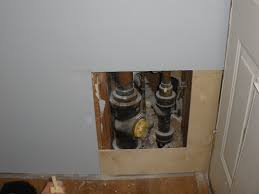 Remodelaholic Hiding Plumbing Access With Wainscoting Wainscoting Plumbing Bathtub Plumbing
