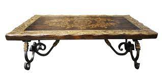In occasional tables, darker tones and heavier materials, like a wood coffee table, take up more visual space than, say, a glass coffee table. Estancia Coffee Table With Hand Forged Iron Legs The Top Has A Unique Europen Design Tuscan Furniture Western Style Decor Tuscan Style