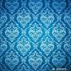Pale green rug, furnishings in blue, pale green, and coral, framed white flower it's been. 1