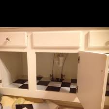 Peel And Stick Tile Under Sinks To Hide Water Damage Updating House Vinyl Flooring Peel And Stick Tile