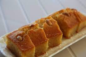 Semolina sponge cake with almonds, hazelnuts total greek yoghurt and honey. Semolina Cake With Lemon Syrup Kalo Prama Recipe Sbs Food