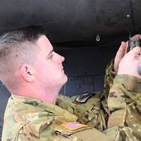 A U.S. Soldier, left, with 1st Battalion, 3rd Aviation