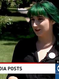 Woman fired over pictures she calls anti-racist, but her employer says  promote violence