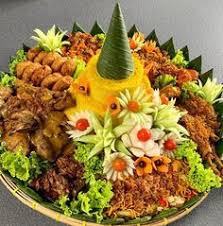 Make time to try the nasi kuning, the bright yellow rice with turmeric and coconut milk flavour, perfect with a sambal combination. Tumpeng