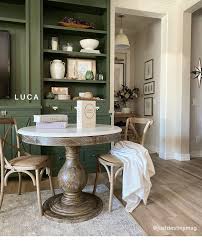 Sturdy timber construction stands in contrast against the sharp corner details, enhancing the texture of the wood and adding subdued interest to this essential piece. Arhaus Looks At Home Dining Styled By You Milled
