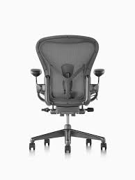 black aeron office chair with aluminum base viewed from the back in 2021 office chair chair aeron chair herman miller